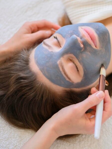 high-angle-woman-getting-face-mask