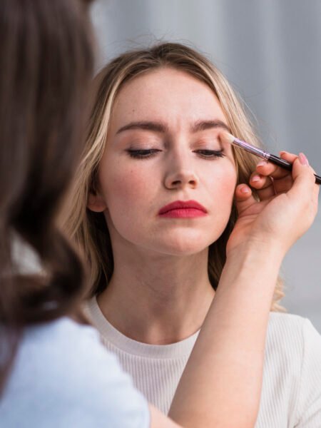 young-woman-applying-makeup-by-visage-artist